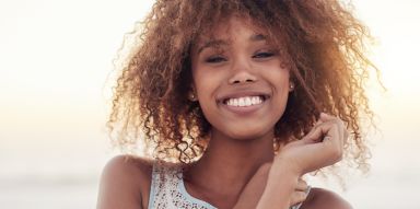 Close up of woman smiling at the beach
